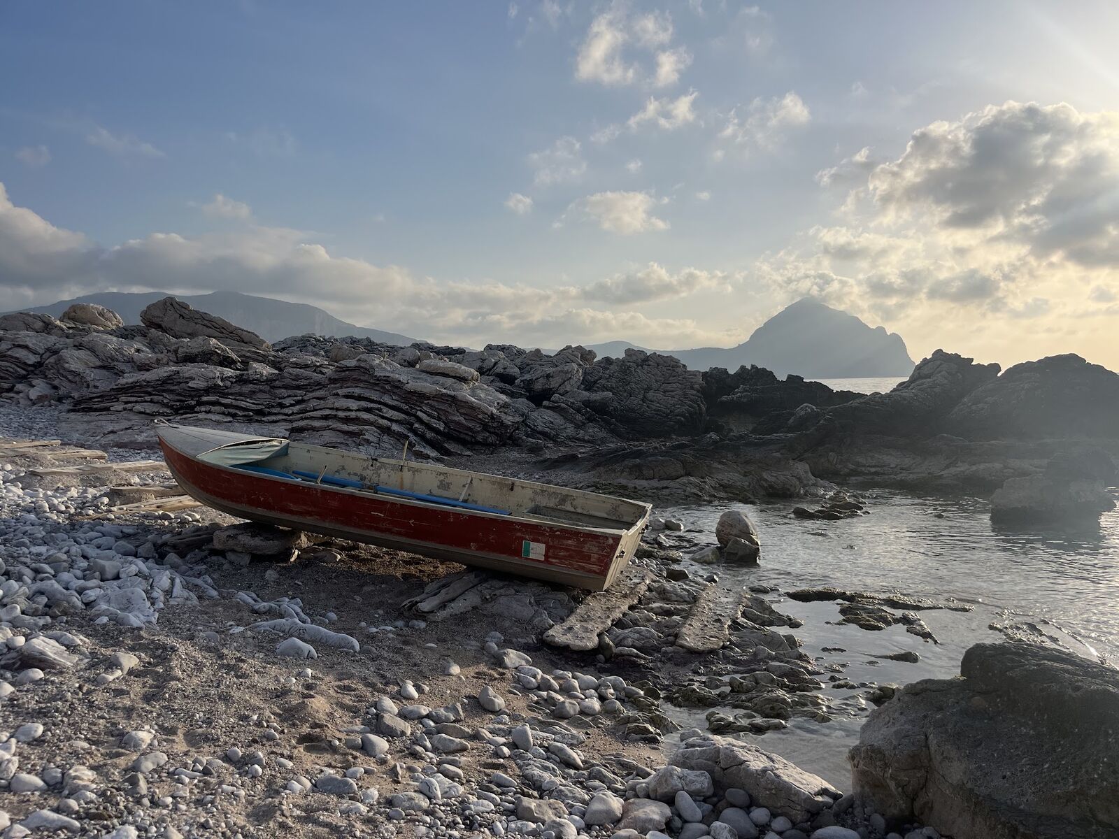 Fishing boats on the rocky shore at Cornino below Monte Cofano